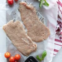 thinly sliced veal cutlets seasoned lightly with salt and pepper to make veal parmesan recipe