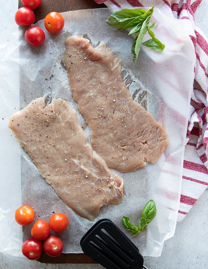 thinly sliced veal cutlets seasoned lightly with salt and pepper to make veal parmesan recipe