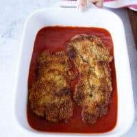 layered golden veal cutlets in tomato sauce