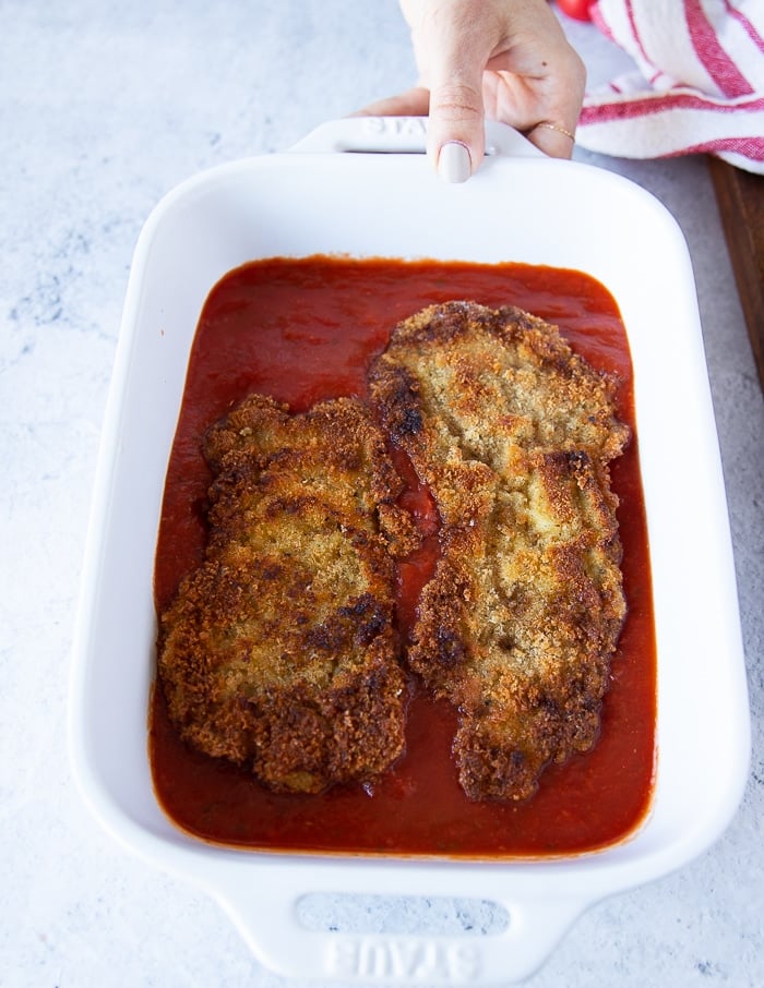 layered golden veal cutlets in tomato sauce