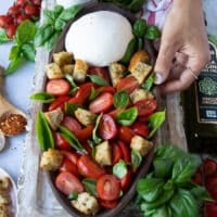 croutons are added to the burrata caprese salad
