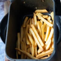 perfectly cooked fries in the air fryer basked ready for carne asada fries recipe