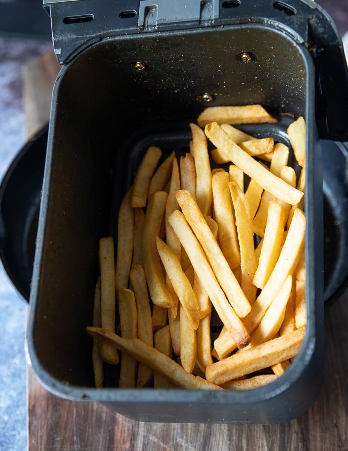 perfectly cooked fries in the air fryer basked ready for carne asada fries recipe