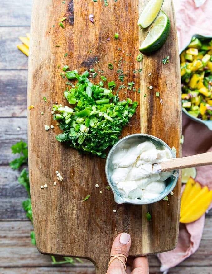 herb crema or sour cream ingredients including sour cream, minced herbs, lime juice, and cilantro