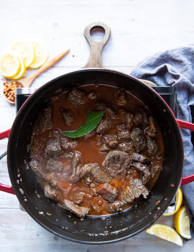 All stew ingredients added into the pot and ready to cook over low heat