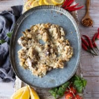 The chopped eggplant is layered at the bottom of a dish to serve Ali Nazik lamb stew