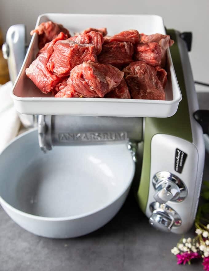 A photo with chunks of lamb meat cut up into cubes to be grinded and make sausage