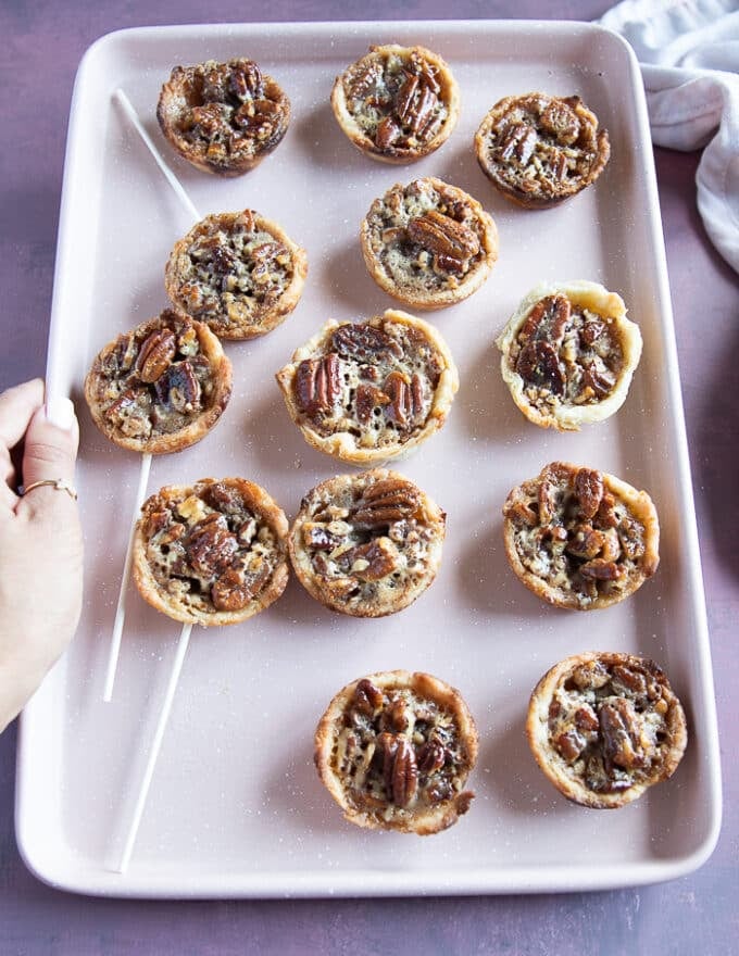 mini pecan pies baked and out of the oven with perfectly set mini pecan pies