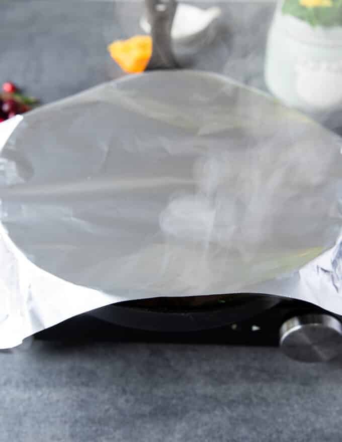 turkey tenderloin covered in foil and ready to roast in the oven. 