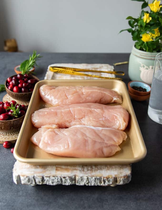 Turkey tenderloins on a sheet pan defrosted and ready tp cook