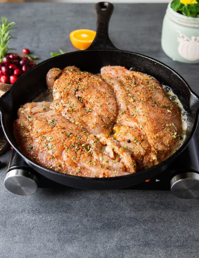 turkey tenderloin in a pan searing with butter