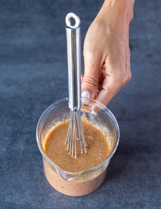 The wet ingredients mixture mixed into a bowl and ready to use over the leg of lamb