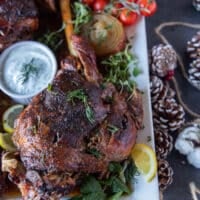 close up of one roast leg of lamb out of the oven golden brown and perfectly cooked