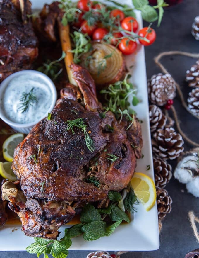 close up of one roast leg of lamb out of the oven golden brown and perfectly cooked