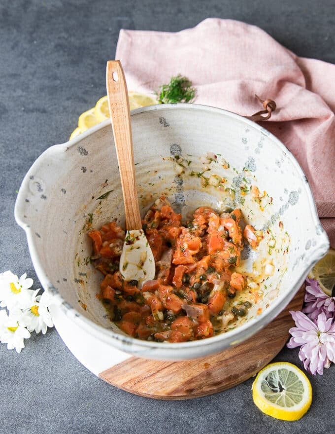 The Salmon cubes are added into the bowl of the marinade and tossed well