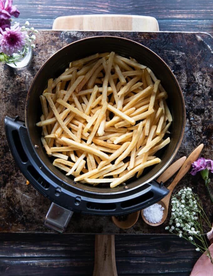 Frozen French Fries in an Air fryer basket 