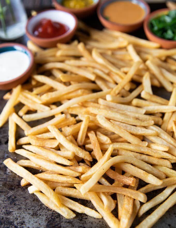Close-up of the frozen french fries coming out of the air fryer, showing how crispy and perfect the texture is