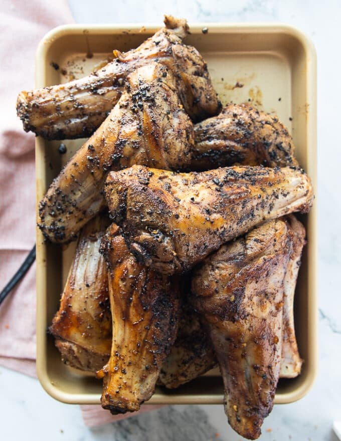 seared and golden lamb shanks removed from the pot so that the braising sauce can be made