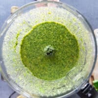 The chermoula sauce all blended up in a food processor bowl