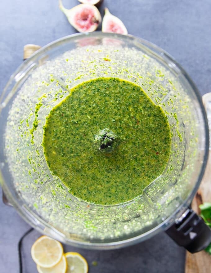 The chermoula sauce all blended up in a food processor bowl