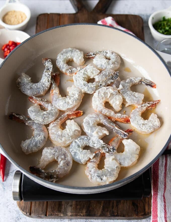 shrimp tossed in flour and added to a sesame oil skillet to sear