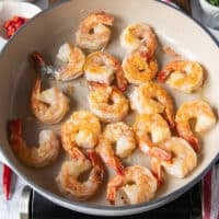 golden shrimp cooked in the pan and flipped over