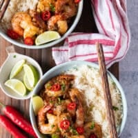 Shrimp coated in chili lime sauce and finished off with chillies and cilantro and then served over white rice