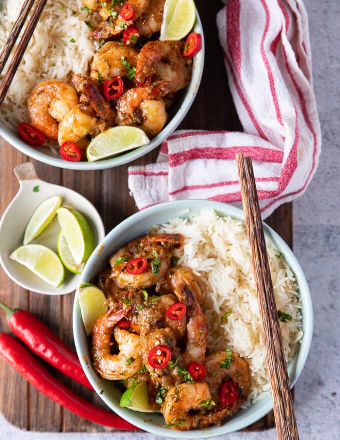 Shrimp coated in chili lime sauce and finished off with chillies and cilantro and then served over white rice