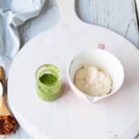 basil Mayo ingreidents including basil pesto, mayo on a white board