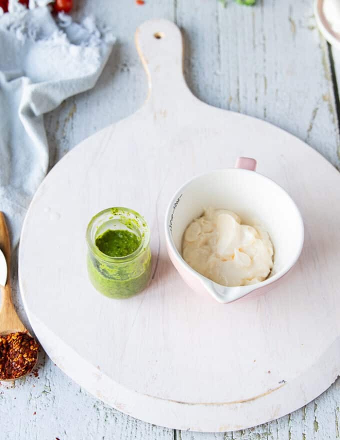 basil Mayo ingreidents including basil pesto, mayo on a white board