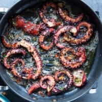 Octopus tentacles on the grill showing how to grill octopus