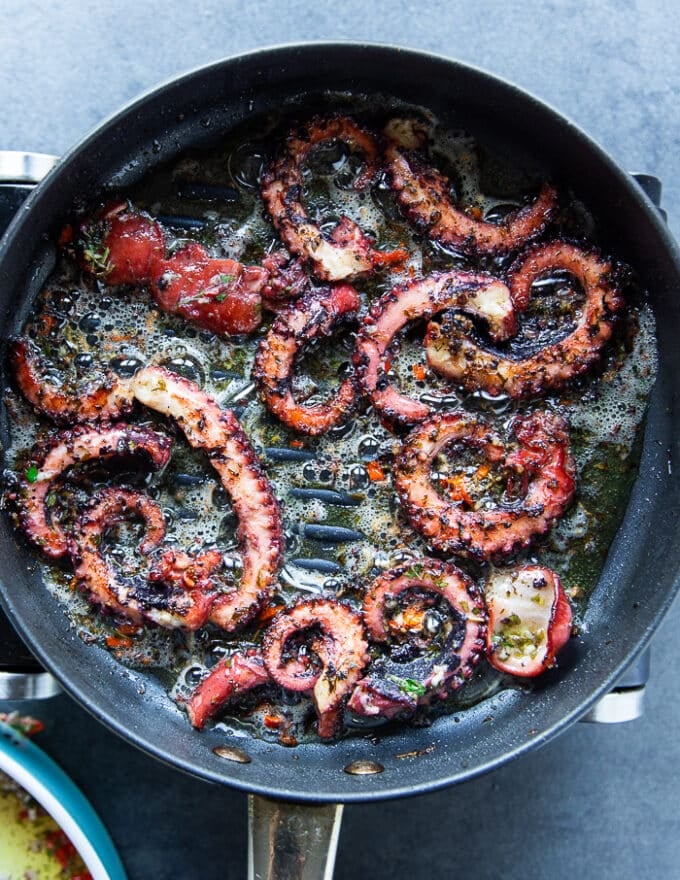 Octopus tentacles on the grill showing how to grill octopus