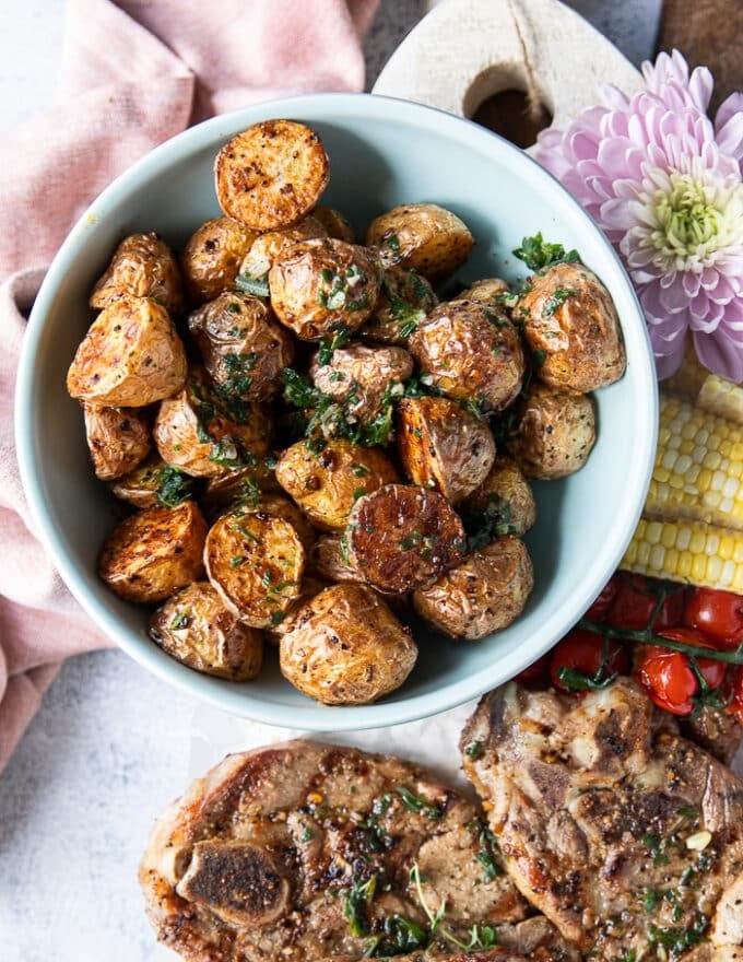 A plate of air fryer potatoes that is served with the lamb steaks