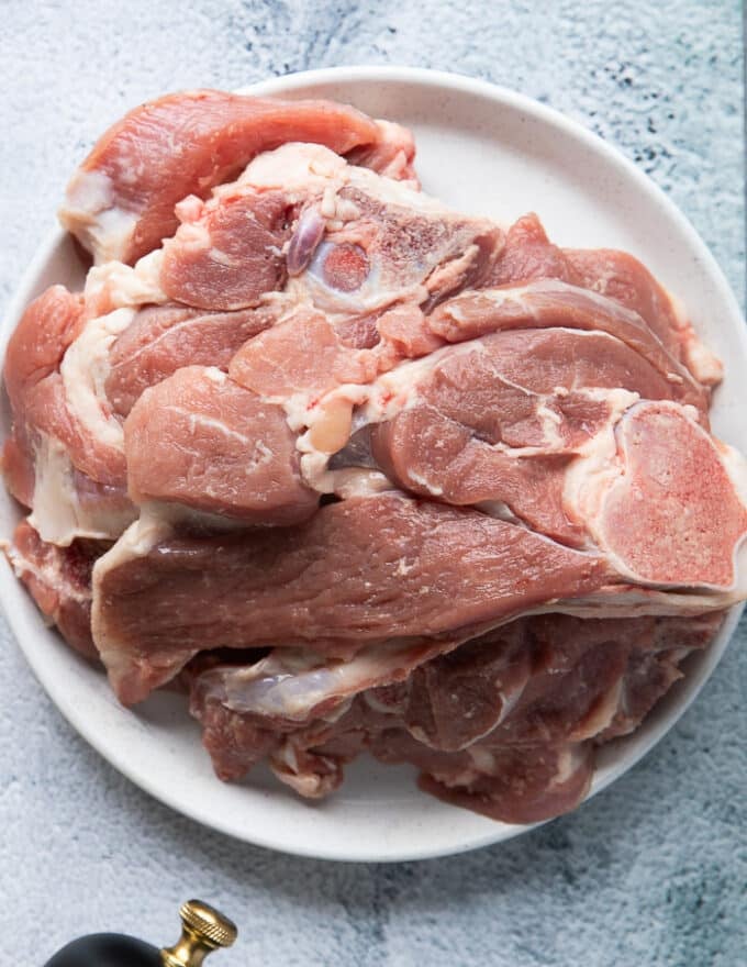 A plate with the smaller cuts of the lamb leg making smaller lamb steaks