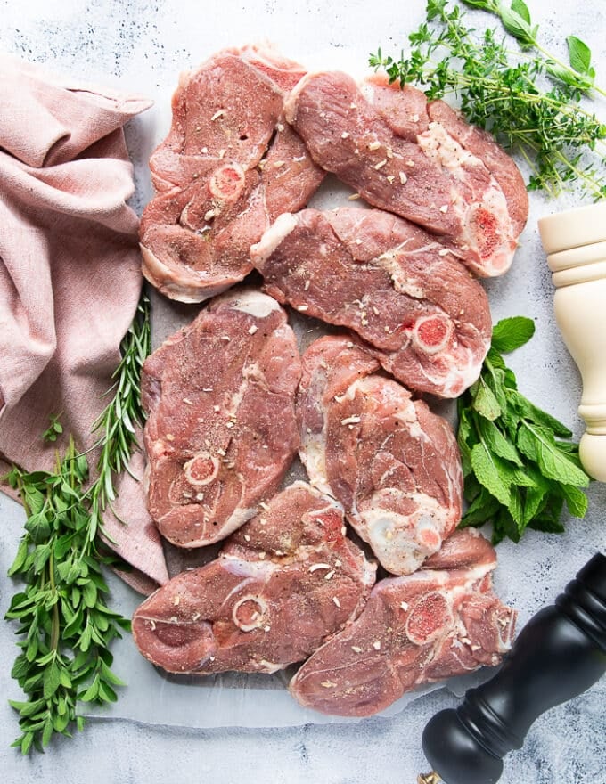 seasoned lamb steaks on both sides with a simple salt, pepper, onion flakes and olive oil