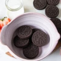 The oreos added to the bottom of a bowl to make oreo mug cake