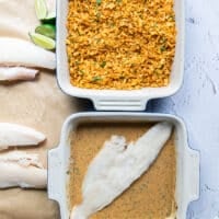 A piece of haddock placed in the wet mixture bowl to begin coating