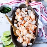 diced shrimp added to a platter and drizzled with lime juice and seasoned lightly