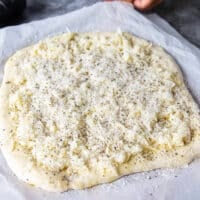 Cacio e pepe pizza ready to go in the oven