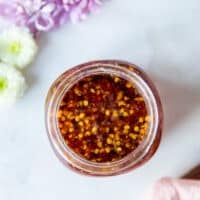 A jar of homemade hot honey top view showing the color and texture of the sauce