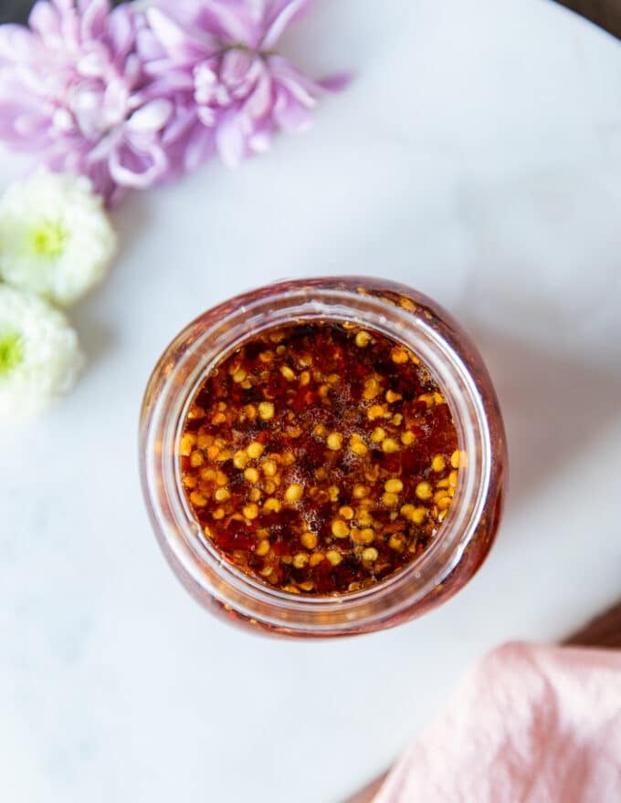 A jar of homemade hot honey top view showing the color and texture of the sauce