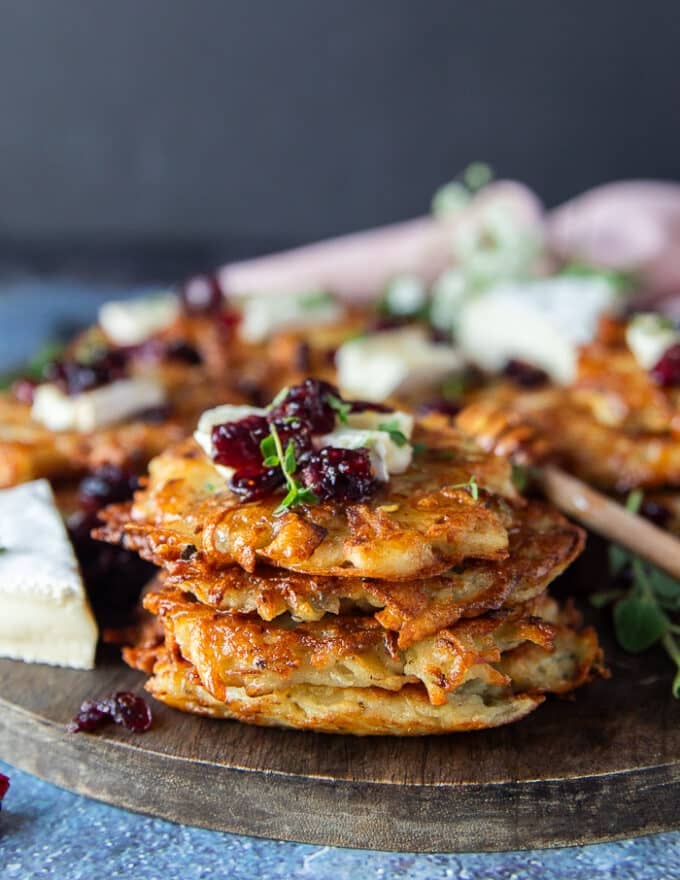 Close up of a stack of potato pancakes showing the golden crisp crust