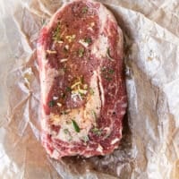 Ingredients for ribeye steak recipe including ribeye steak and seasoning