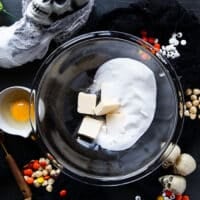 The butter and sugar are added to a large bowl