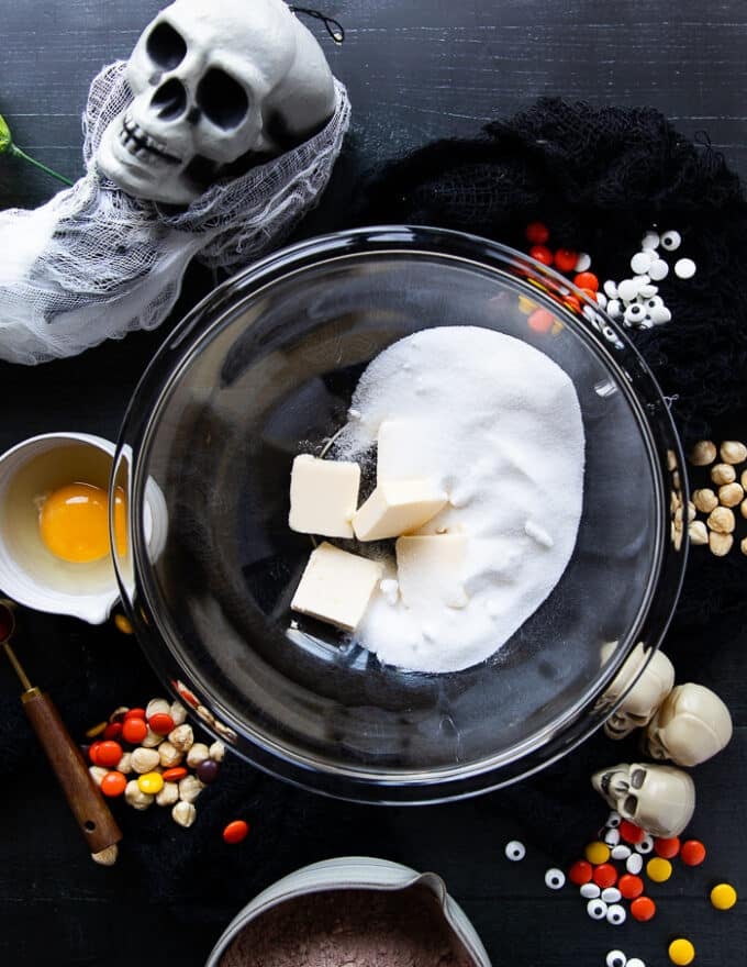 The butter and sugar are added to a large bowl 