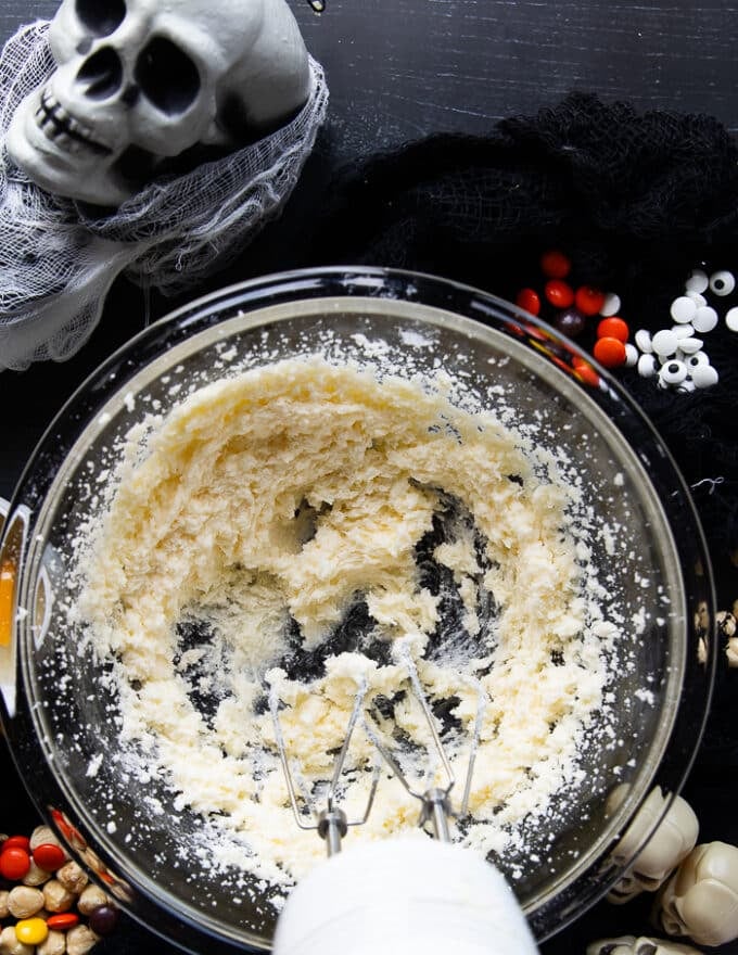 Fluffy beaten sugar and butter in a bowl 