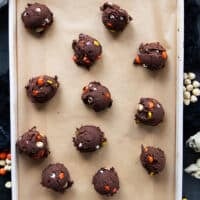 Halloween Cookies scooped out on a parchment lined baking sheet