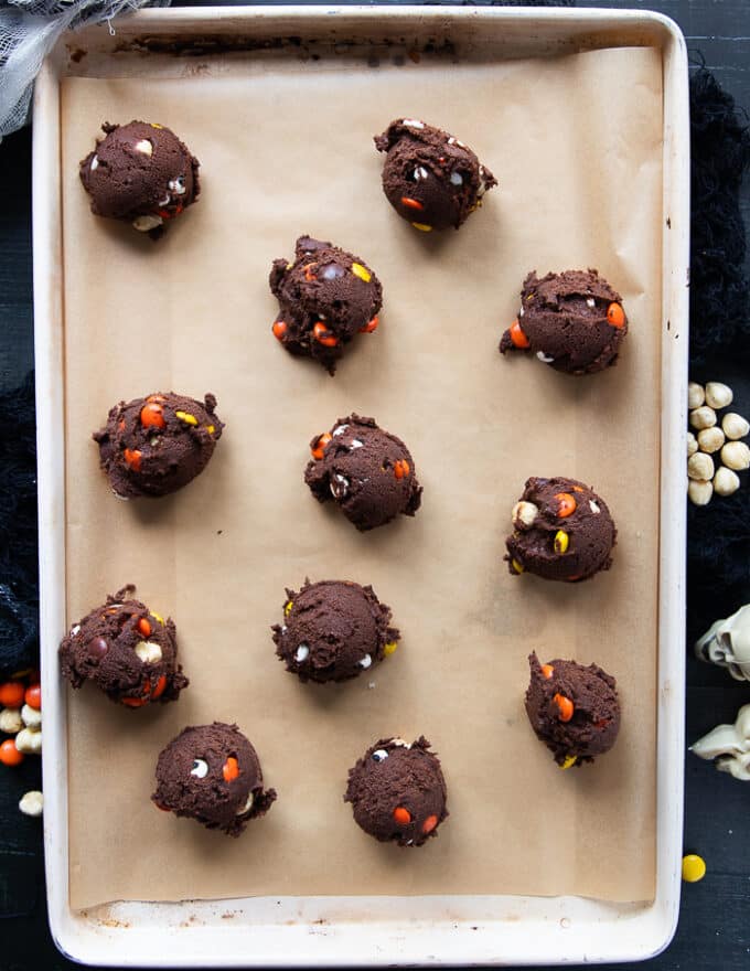 Halloween Cookies scooped out on a parchment lined baking sheet