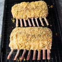 Both racks are coated and placed on a baking rack ready to go in the oven to roast