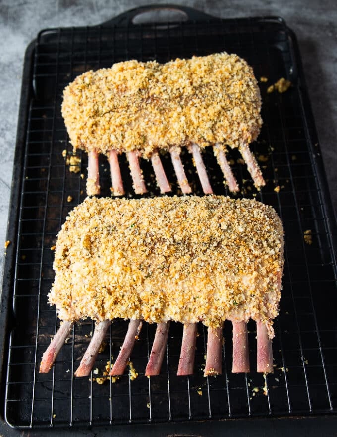 Both racks are coated and placed on a baking rack ready to go in the oven to roast